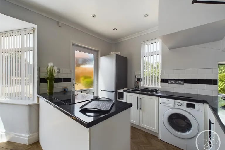 Fitted with a range of base units with work surfaces over incorporating a sink and drainer unit, electric oven and hob. Picture by Stoneacre Properties