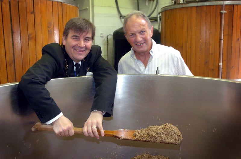 The Lord Mayor of Sheffield councillor Roger Davison and brewery owner David Wickett stir the mash for the new 'Pride of Sheffield' brew at the Kelham Island Brewery in July 2005.
