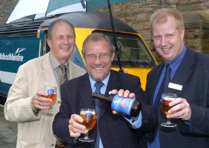 Minister for Sport and Sheffield MP Richard Caborn tries out a new ale from the Kelham Island Brewery, Pale Rider, which is to be made available on the Midland Main Line route, in 2004. Also pictured are kelham Island brewery owner dave Wickett (left) and Midland Mainline head of catering Mr Duncan Fraser (right) 