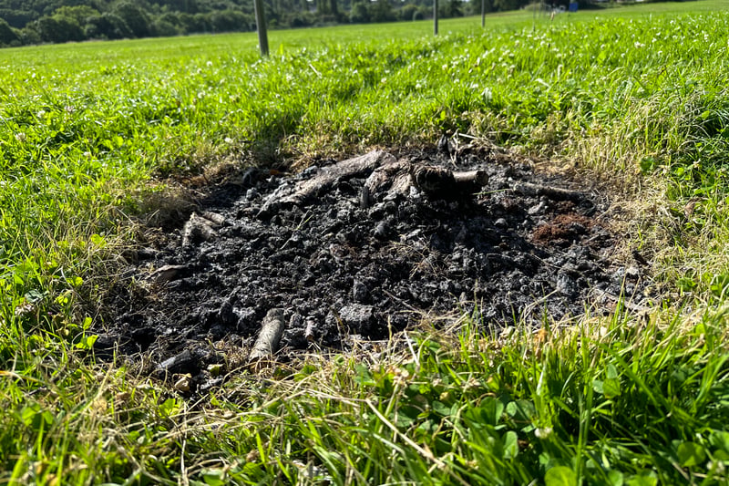 As well as rubbish on the site, there is evidence of bonfires lit on the grass surface