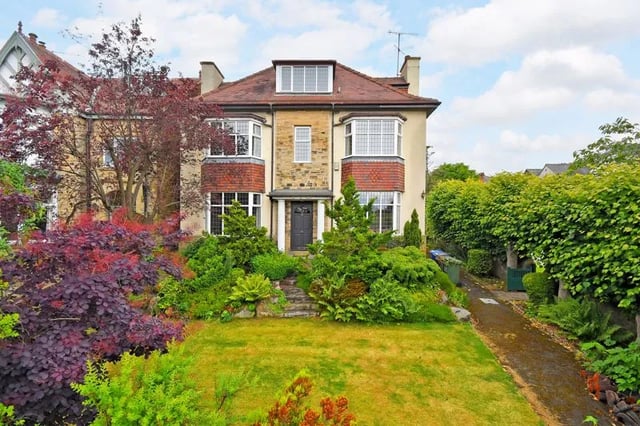 The entrance to the property has a traditional English feel to it, with two bay windows and a large front garden.