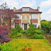 The entrance to the property has a traditional English feel to it, with two bay windows and a large front garden.