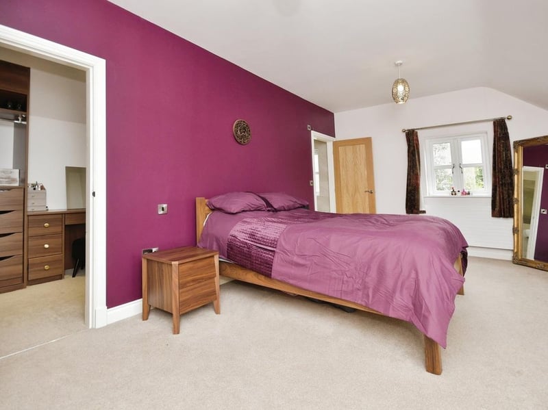 The main bedroom features a walk-in wardrobe and ensuite.