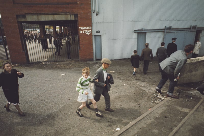 Supporters make their way into the ground before a match between Celtic and Tottenham Hotspur at Hampden Park