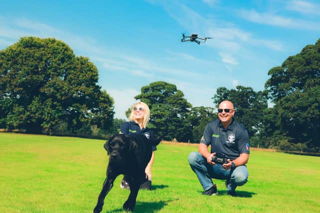 Rebecca (Operations Director at Coptrz) and Phil, founder of Drone to Home, with Travis the Dog