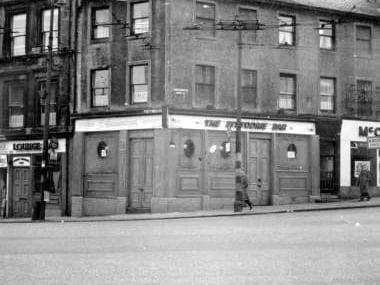 The Pittodrie Bar was found on the corner of Cowcaddens St and West Nile St with this photograph being dated as 1963. Cowcaddens was completely redeveloped in the late sixties.