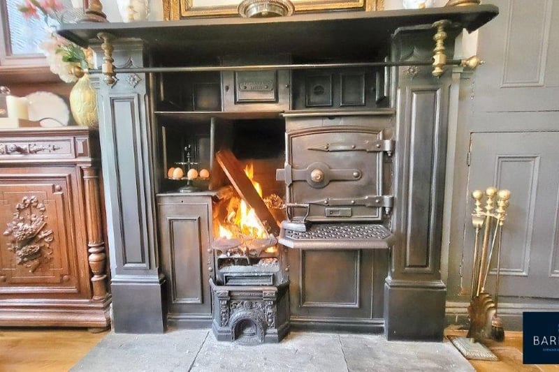 The original restored Victorian Yorkshire range log fire oven on a Yorkshire stone hearth.