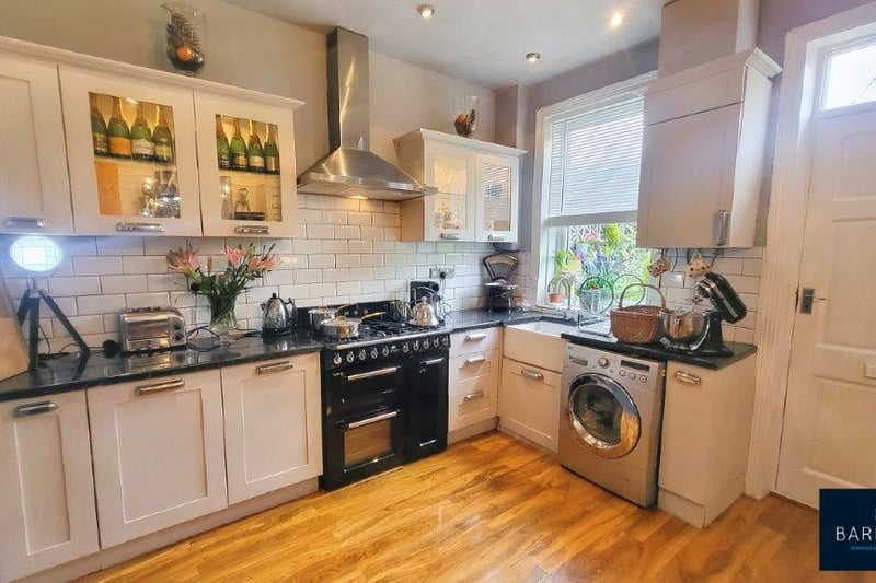 The kitchen has fitted wall units, a Belfast sing and Smeg range cooker and boiler.