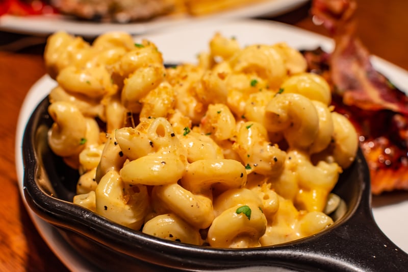 This multi-award-winning independent Jamaican restaurant makes a creamy homemage macaroni covered with a crispy cheese crust and springkled with jerk spices for a rich taste. (Photo - Chansak Joe A. - stock.adobe.com)