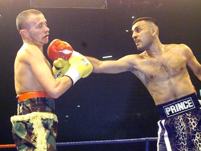 WBO Featherweight Champion Prince Naseem Hamed lands a big right hand on challenger Paul Ingle during his title defence at the Manchester Arena Saturday April 10, 1999. Hamed retained his title with an eleventh round stoppage. Photo: OWEN HUMPHREYS/PA