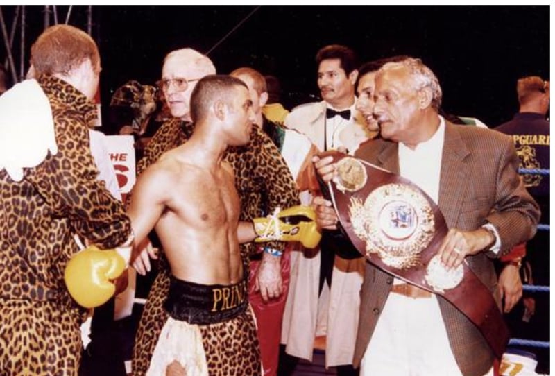 Naseem Hamed is congratulated by his dad in the ring after he overwhelmed Steve Robinson in Cardiff in 1995.