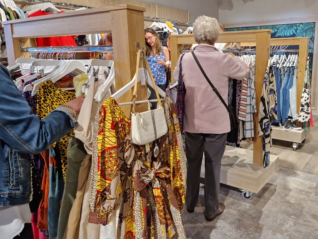 Customers were filtered in on the opening day to browse the racks of beautiful clothes.