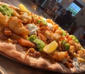 The Devonshire Arms has blown customers away with their fish and chips pizza, featuring a curry sauce base and topped with mushy peas.