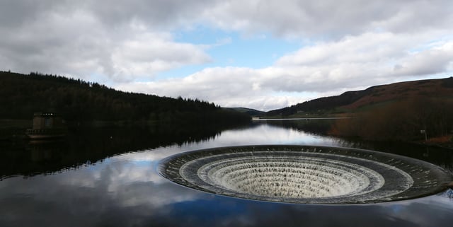 Ladybower Reservoir, just a short drive from Sheffield, is home to what are surely two of the world's most awesome 'plugholes', used to drain excess water after heavy rainfall. One of those overflows features in a thrilling action sequence in Mission:
Impossible – Rogue Nation. In it, Ethan Hunt (Tom Cruise) jumps into a water tank at what is supposed to be a Moroccan power station. The Peak District footage, shot using drones after a three-month wait for sufficient rainfall, were added using CGI trickery. Tom Cruise was in the Peak District in 2021 to film an epic train scene in Stoney Middleton for Mission: Impossible - Dead Reckoning Part One. Photo: Lynne Cameron/PA Wire