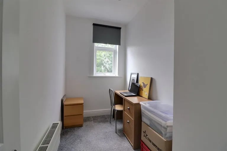 The second bedroom can be used as a study or office space.
