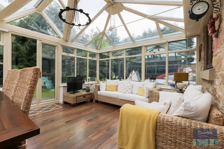 The conservatory provides another, brighter location to sit and relax.