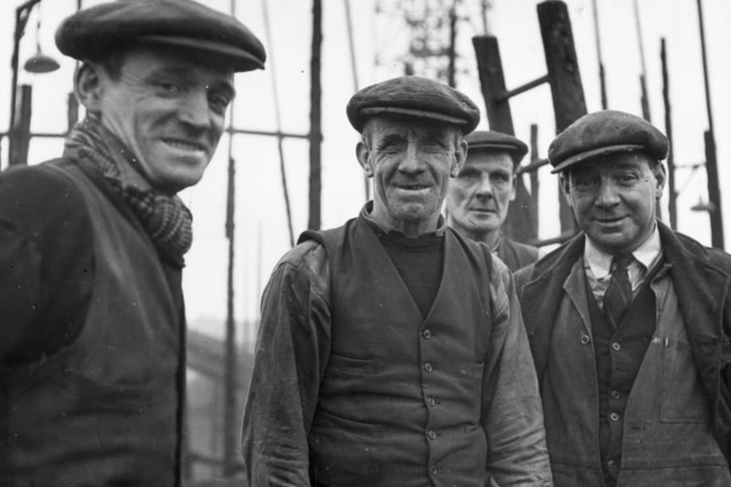 Four workers from the Harland & Wolff Shipyard flash a rare smile at the camera in 1955. Shipbuilding was hard, exhausting work - not that Glaswegians ever shied away from a bit of hard work.