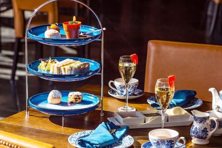 Afternoon tea at the Titanic Hotel includes a selection of finger sandwiches, sweet treats and scones with cream and jam paired with a glass of Prosecco. There are also dedicated menus for dietary requirements.