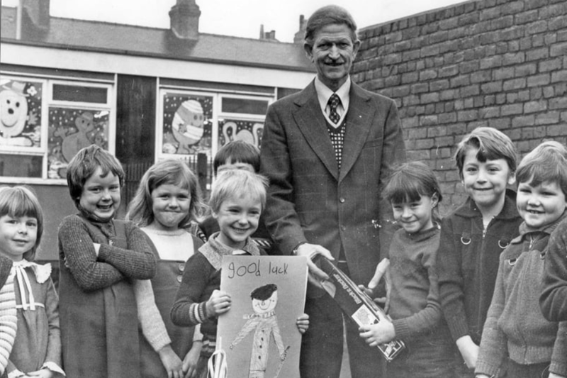 Caretaker Mr James Telford, retired from Barnes Road Infants School in 1979. He is pictured being presented with a drill by Jane Dorothy, aged six, and a "Good Luck" card by Steven Oren, six. Photo: Shields Gazette