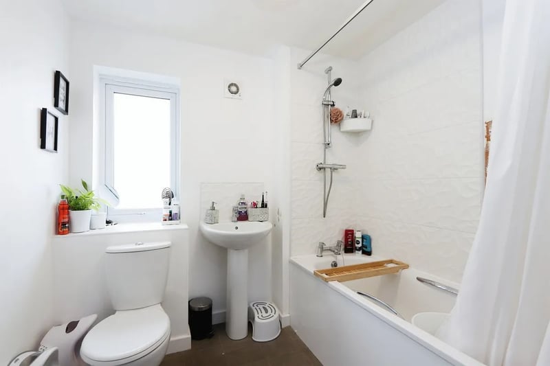 The family bathroom is equipped with a toilet, sink and shower/bath. (Photo courtesy of Zoopla)