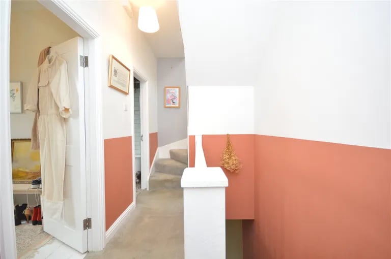The first floor landing with stairs to the loft.
