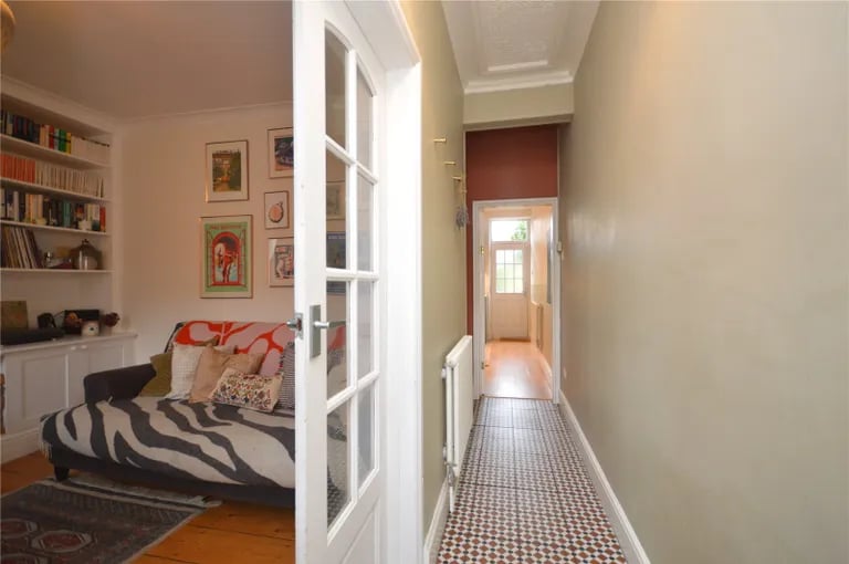 The bright hallway with tiled floor.