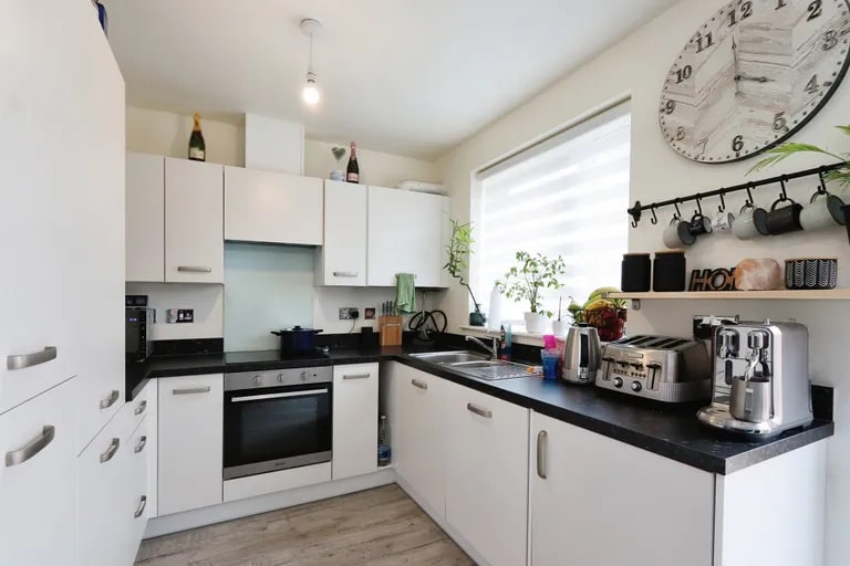 The modern kitchen features a lot of storage and a range of integrated appliances. (Photo courtesy of Zoopla)