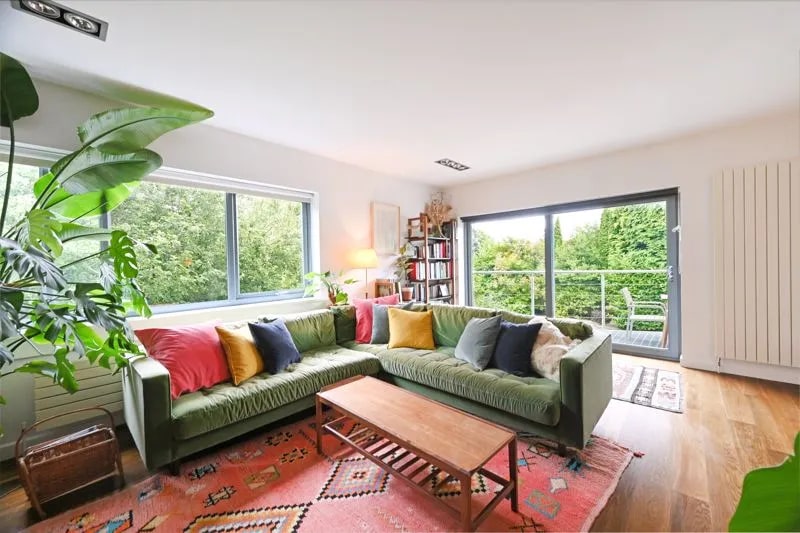 Like much of the property, the living room has enormous windows, which create a very bright interior. (Photo courtesy of Zoopla)