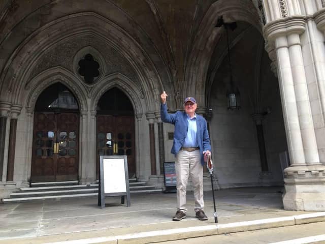 Stanley Luckhurst on the steps of the Royal Courts of Justice celebrating his win against Excel Parking. 