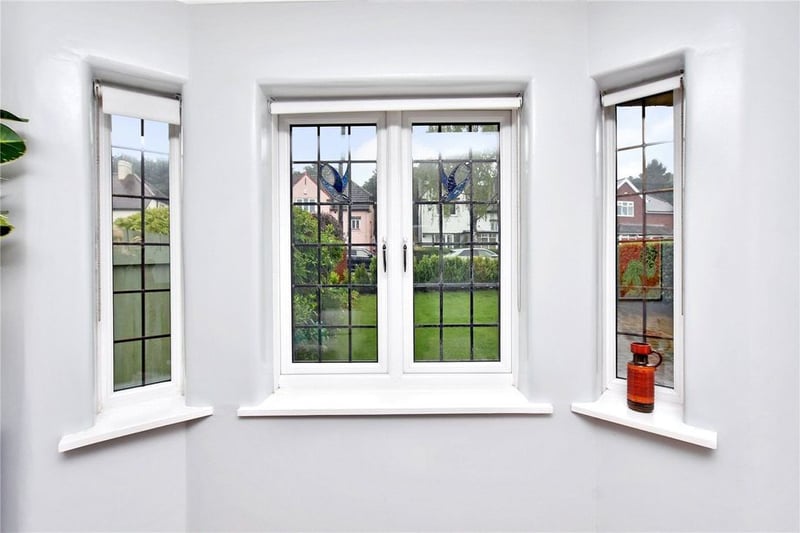 Large double-glazed bay window overlooks the front garden.