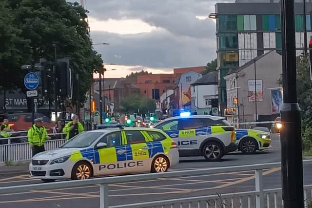Emergency services at the scene of a crash at St Mary's Gate in Sheffield. Yorkshire Ambulance Service said it was called to reports of a collision involving a car and a motorbike, and one person had been taken to hospital