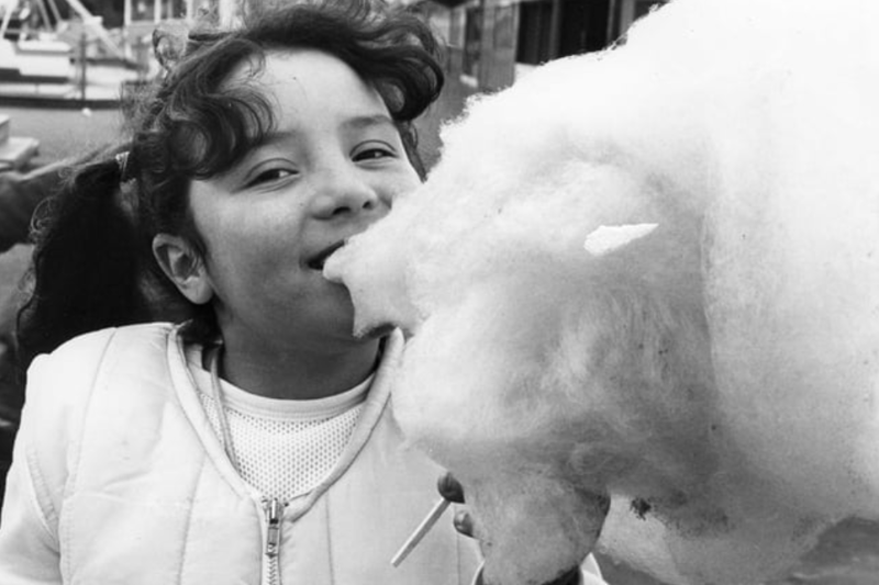Leanne Urwin, 8, tucks into candy floss at the fairground in this April 1983 photo in South Shields. Photo: Shields Gazette