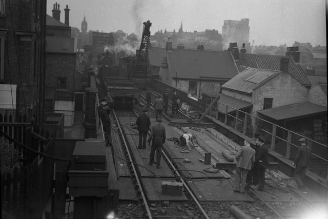 Reconstruction work on Sheepfolds North Bridge, in 1948.
Inconvenience to passengers was restricted to a minimum, and the emergency bus service between the two stations functioned admirably.