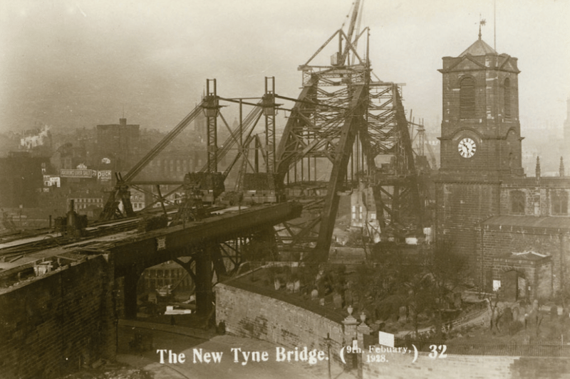 A view from Gateshead of the Tyne Bridge under construction, 9 February 1928. Take note of the old advertisement boards underneath the castle. (Tyne & Wear Archives & Museums) 
