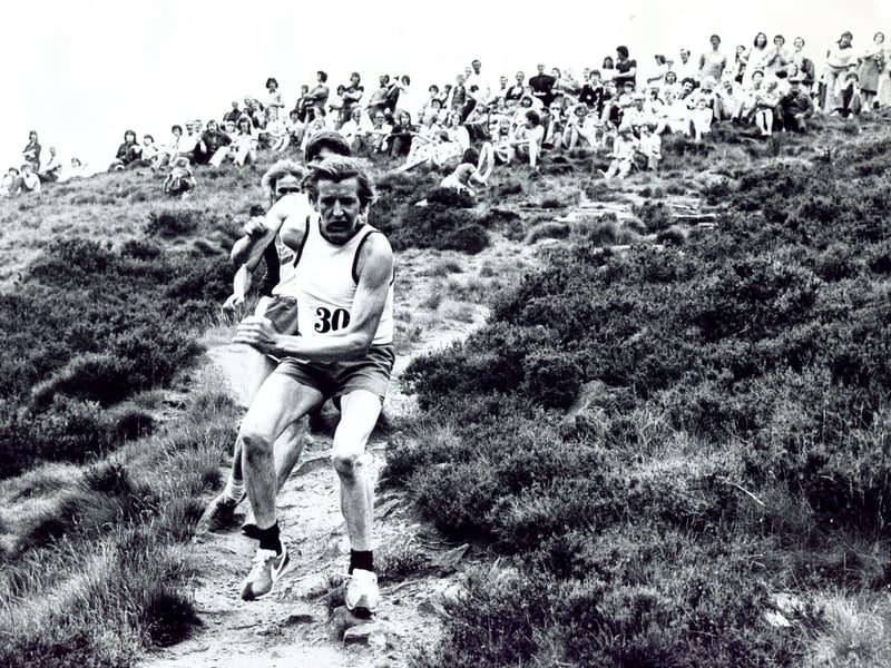 Competitors in the Hallam Chase, from the Hallam FC ground, down Den Bank, up to Stannington and back, in 1976. In the foreground is E Kirkup, of Rotherham Harriers