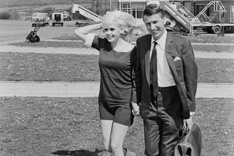 American actress and Playboy model Jayne Mansfield with friend, club owner and entrepreneur Alan Wells, at Bristol Airport in May 1967. Mr Wells ran the Webbington Hotel near Weston-super-Mare, and this luring of Mansfield to his club was big news at the time. Less than eight weeks after this picture was taken, Mansfield would die in a road crash in America.