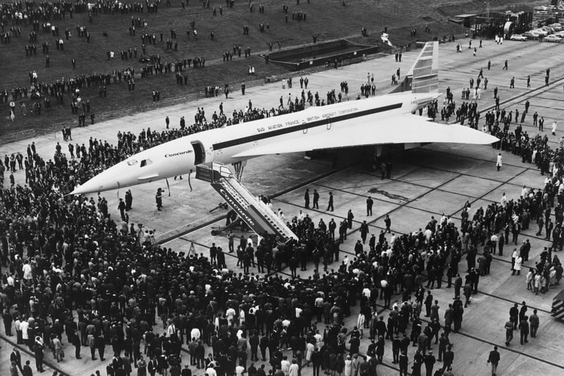 Britain’s prototype of the Anglo-French supersonic Concorde airliner being rolled out of its hangar at the British Aircraft Corporation works at Filton, Bristol. Surrounding the aircraft are crowds of BAC employees, who helped with its construction.  