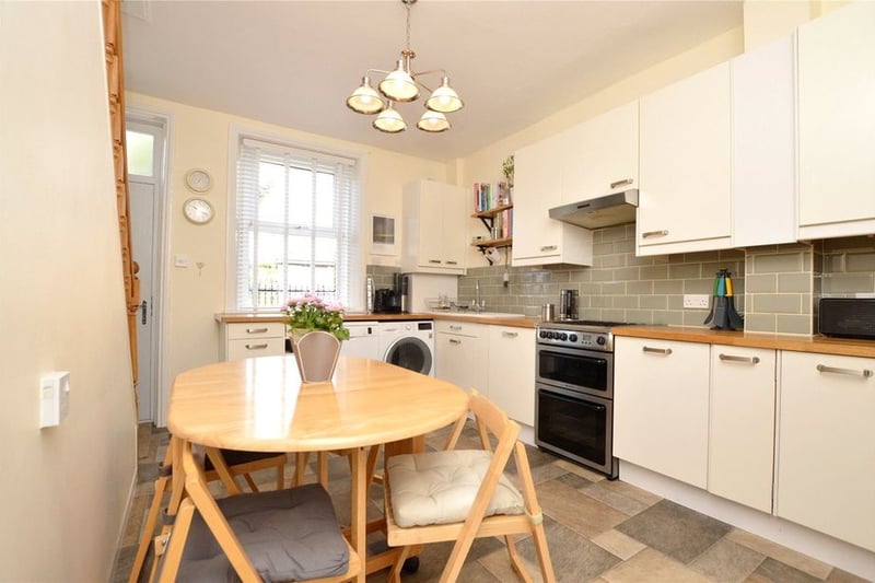 The entrance leads to this charming dining kitchen with cream fitted units.