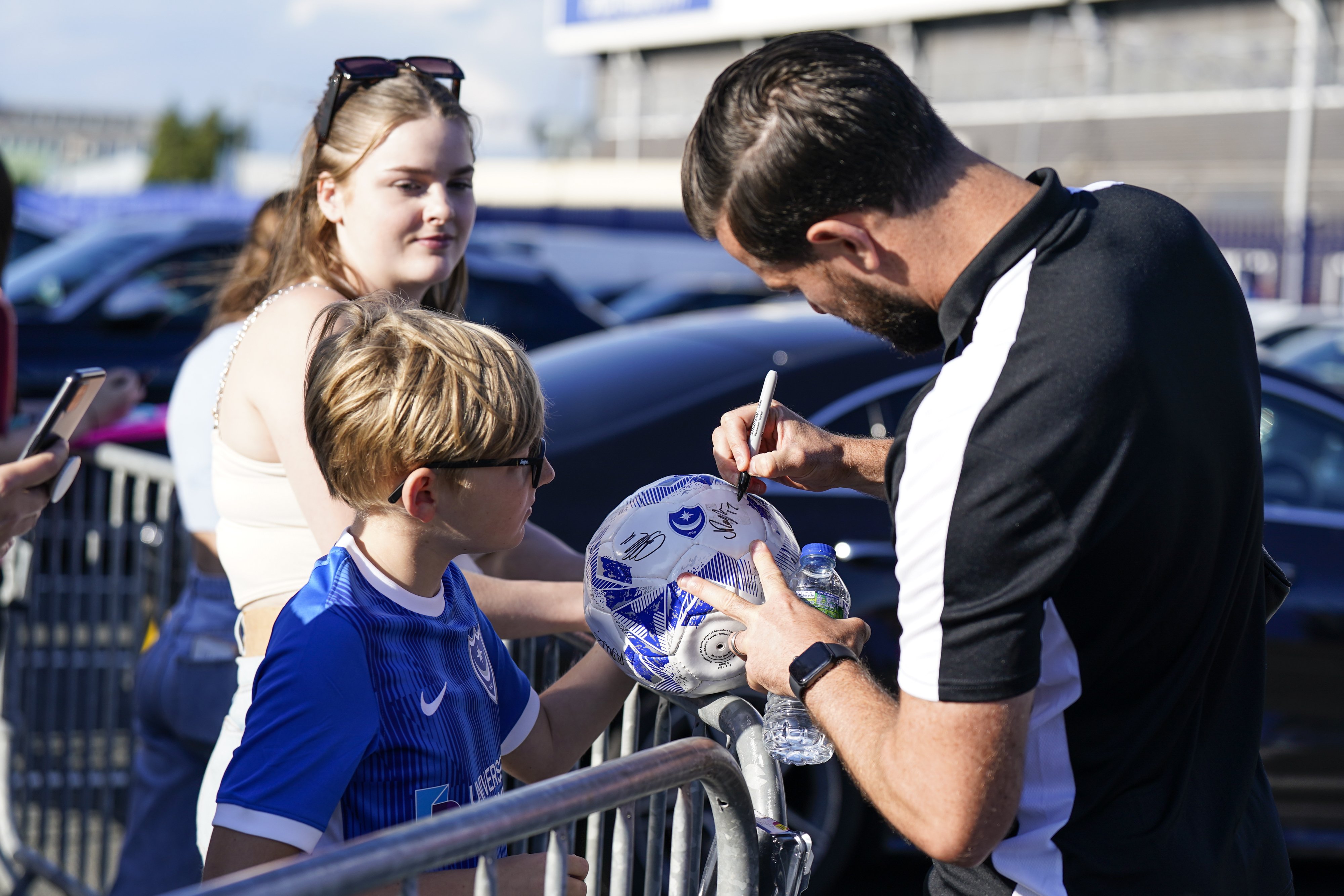 Portsmouth fans outside of Fratton Park with Joe Rafferty ahead of kick-off.