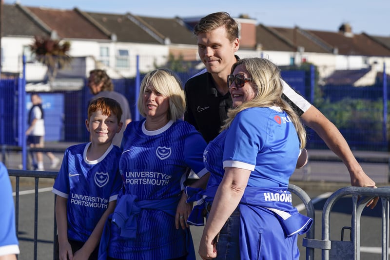 Portsmouth fans outside of Fratton Park with Sean Raggett ahead of kick-off.
