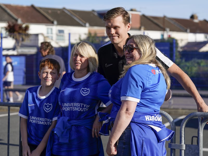 Portsmouth fans outside of Fratton Park with Sean Raggett ahead of kick-off.