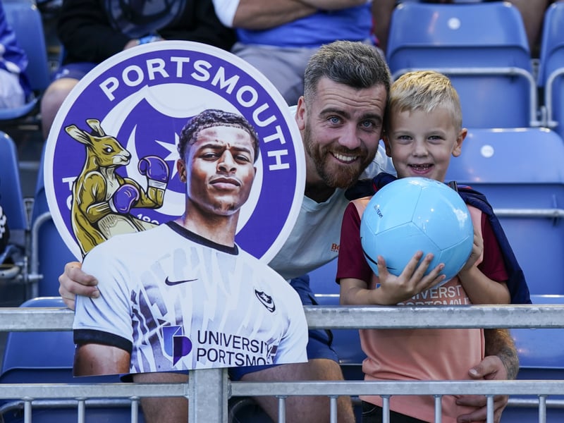 Portsmouth fans inside of Fratton Park ahead of kick-off with a Kusini Yengi sign. 