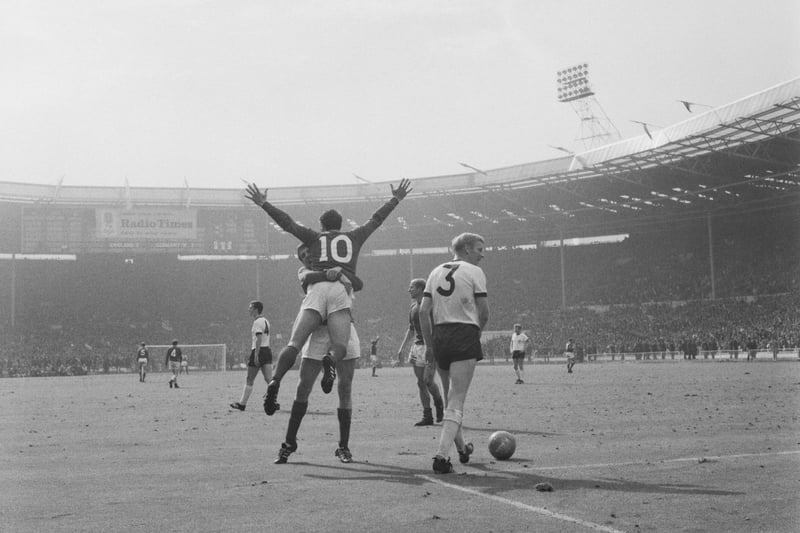 In glorious black and white, England footballer Geoff Hurst (10) is hugged by a team-mate at Wembley Stadium in London, during the World Cup Final between England and West Germany. Colour TV did not land in the UK until 1967 meaning 1966 was the last World Cup televised in black and white image
