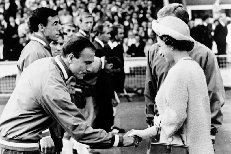 A 40-year-old Queen Elizabeth II greets playing during the World Cup tournament. If Lionesses are succesful, they will likely be greeted by King Charles during their celebrations (AFP via Getty Images)