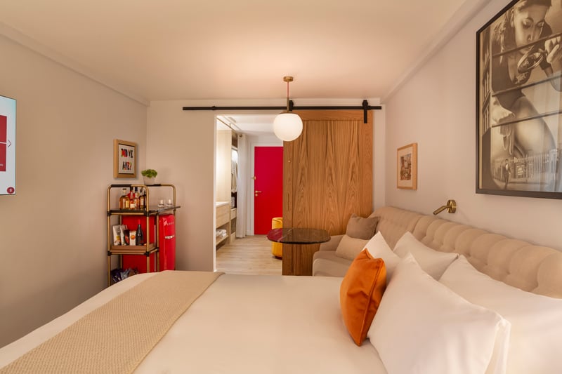 A King bedroom inside the Virgin Hotel in Glasgow - wood-sliding doors separate the sleep and relaxation lounge from the dressing area in every room, ‘giving guests optimal privacy.'