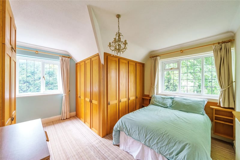A spacious double bedroom with fitted wardrobes.