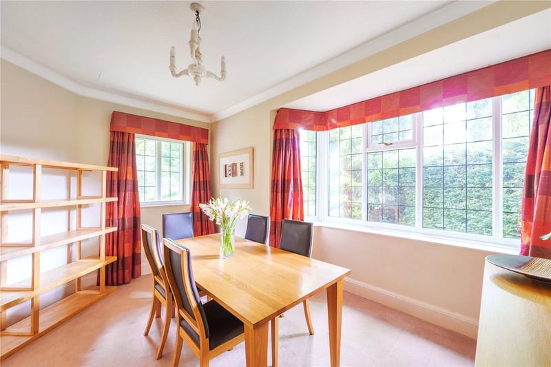 A large separate dining room with large windows is the perfect space for entertaining.