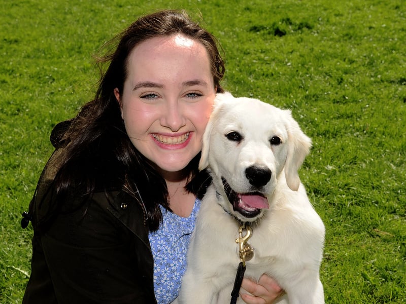 Sophie Bennett with golden retriever Colin who won best puppy.