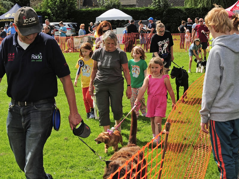 Dogs and owners attending the Fun Dog Show.