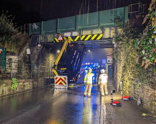 A stricken van hanging off of a Dronfield railway bridge has been rescued following a bizarre accident. (Photo courtesy of Derbyshire Fire and Rescue)